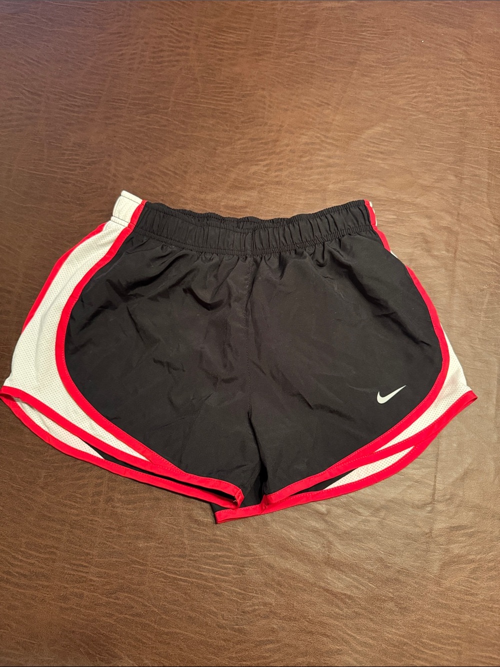 Nike Women’s Black Athletic Shorts with Red Trim and White Panels